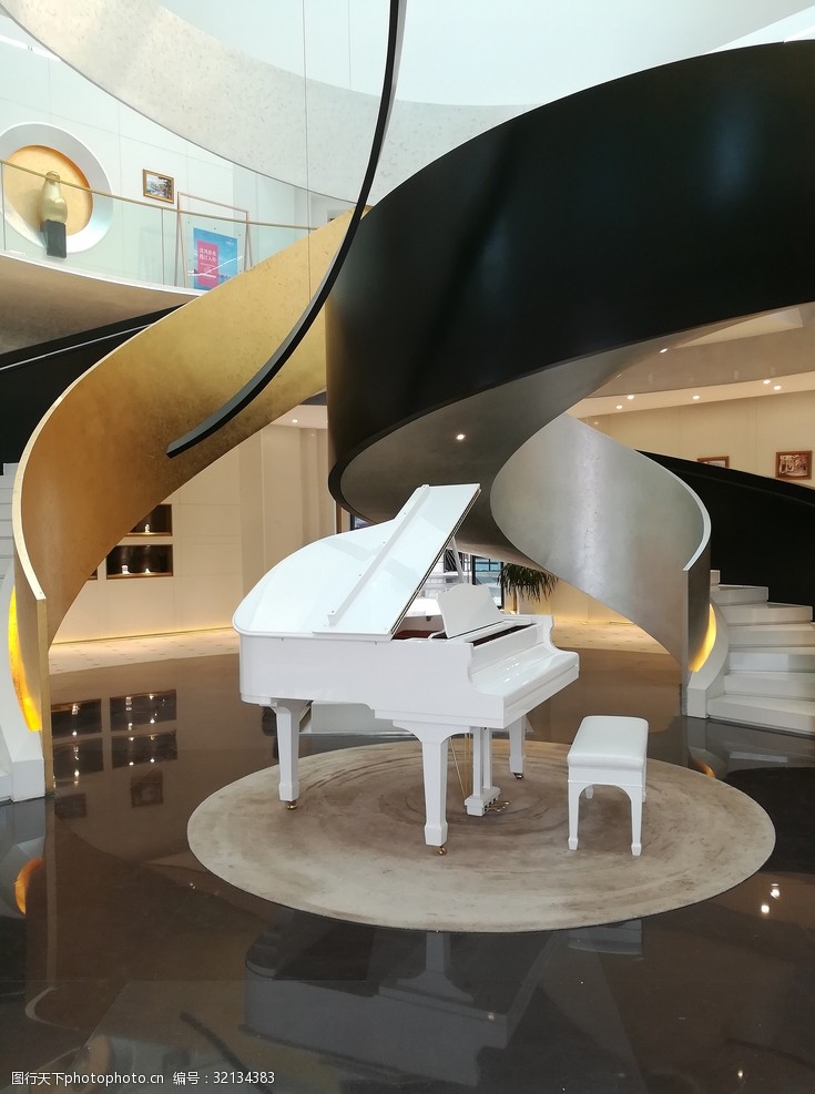 关键词:售楼部一角 售楼部 楼梯 钢琴 白色钢琴 旋转楼梯 摄影 商务